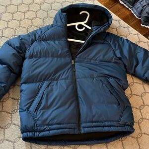 Blue UnWorn Puffer Jacket from The North Face with Black Fuzzy Interior